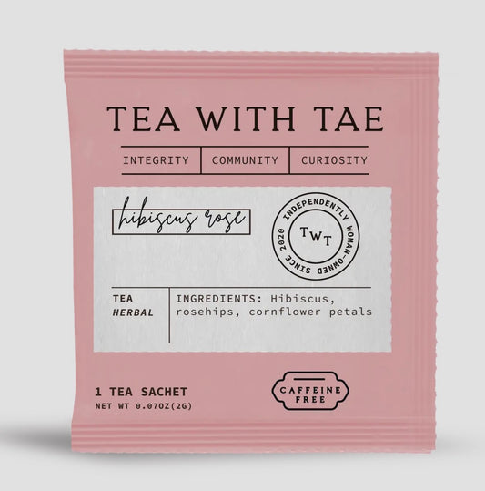 Tea with Tae hibiscus rose tea sachet packaging on a white background