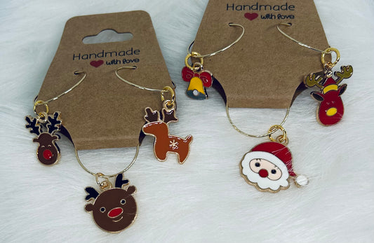 Three pieces of Christmas-themed wine glass charms on brown cards with 'Handmade with Love' text.