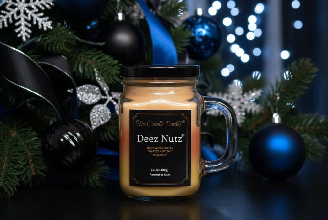 Jar candle labeled 'Deez Nutz' with Christmas decorations in the background