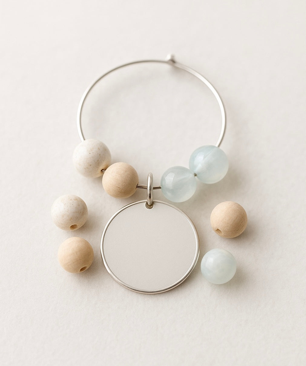 Customizable wine glass charms on a white background. Ethereal By Lez. 