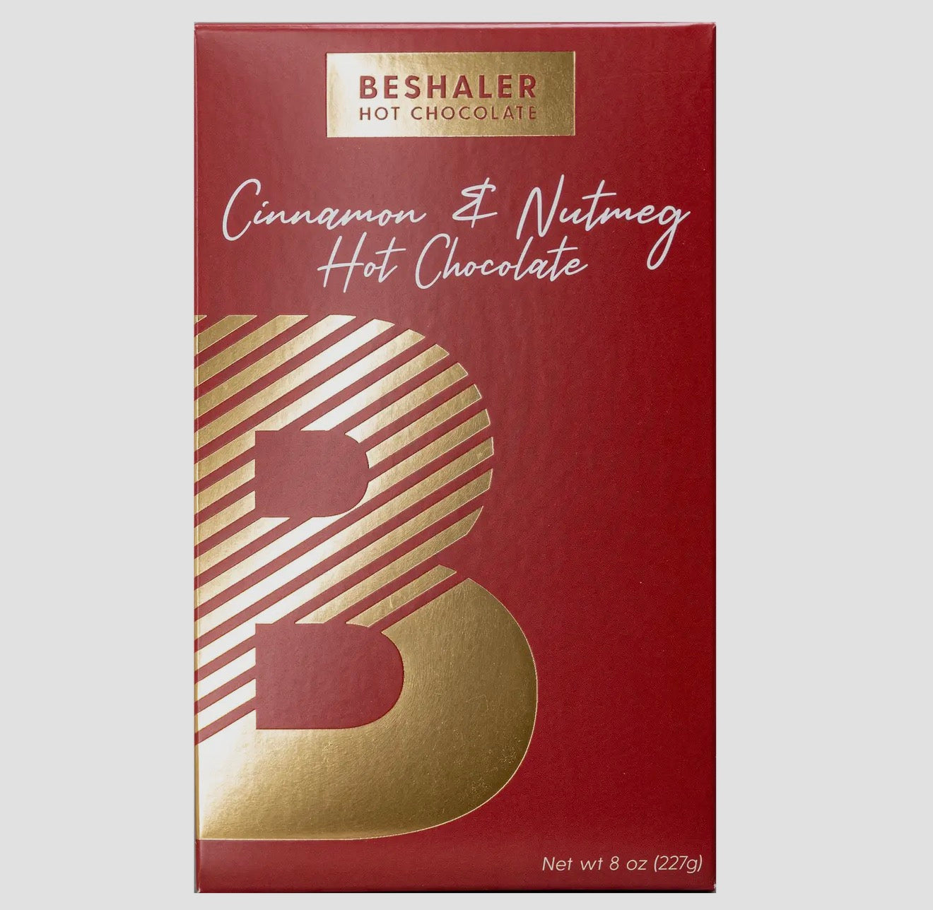 Beshaler Cinnamon & Nutmeg Hot Chocolate packaging on a light gray background