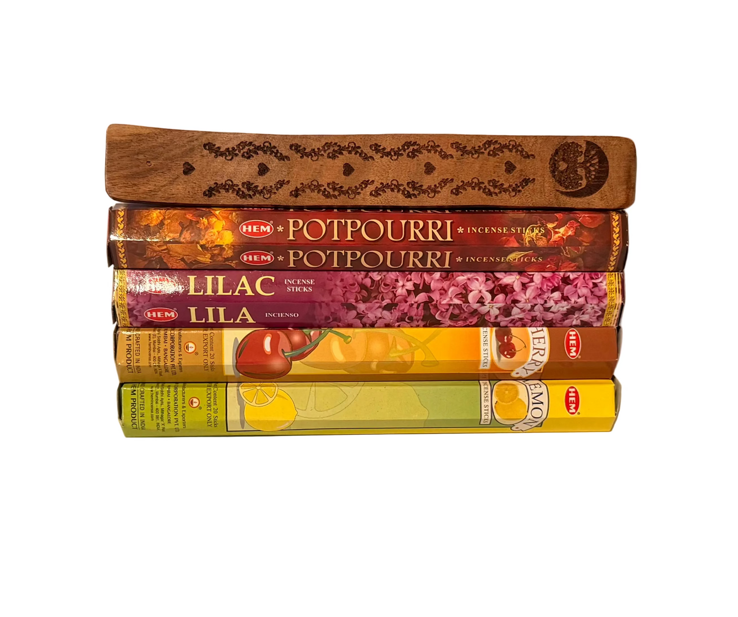 Stack of HEM potpourri cherry lilac and lemon incense sticks packaging on a beige background