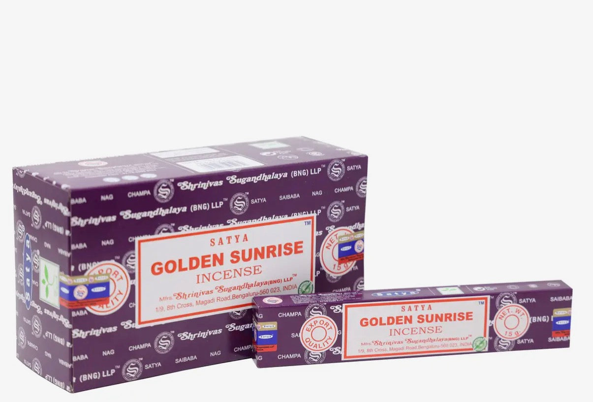 Two boxes of Satya Golden Sunrise incense on a white background