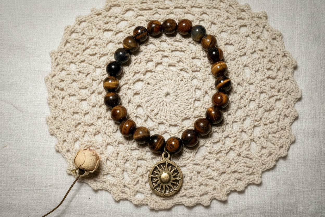 Tigers Eye Stone bracelet with a Sun pendant on a crocheted doily