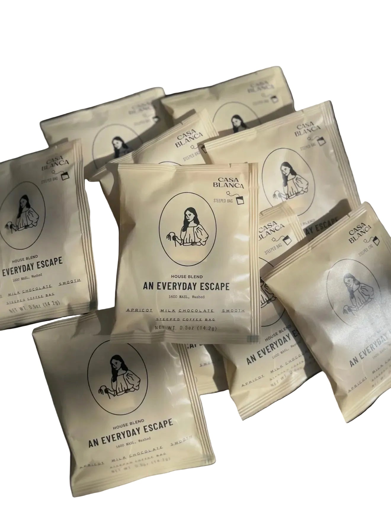Multiple packages of 'An Everyday Escape' steeped coffee on a white background