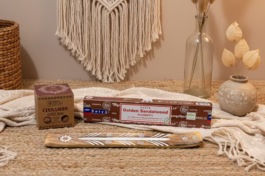 Cinnamon smudge bomb and sandalwood incense with Buddha scene