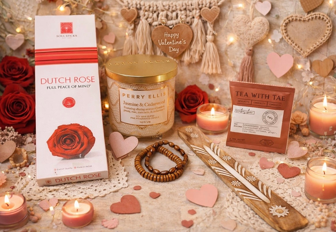 Valentine's Day-themed products including a candle, tea bag, and rose incense box with burner on a decorative background with candles, jewelry, and heart decorations.