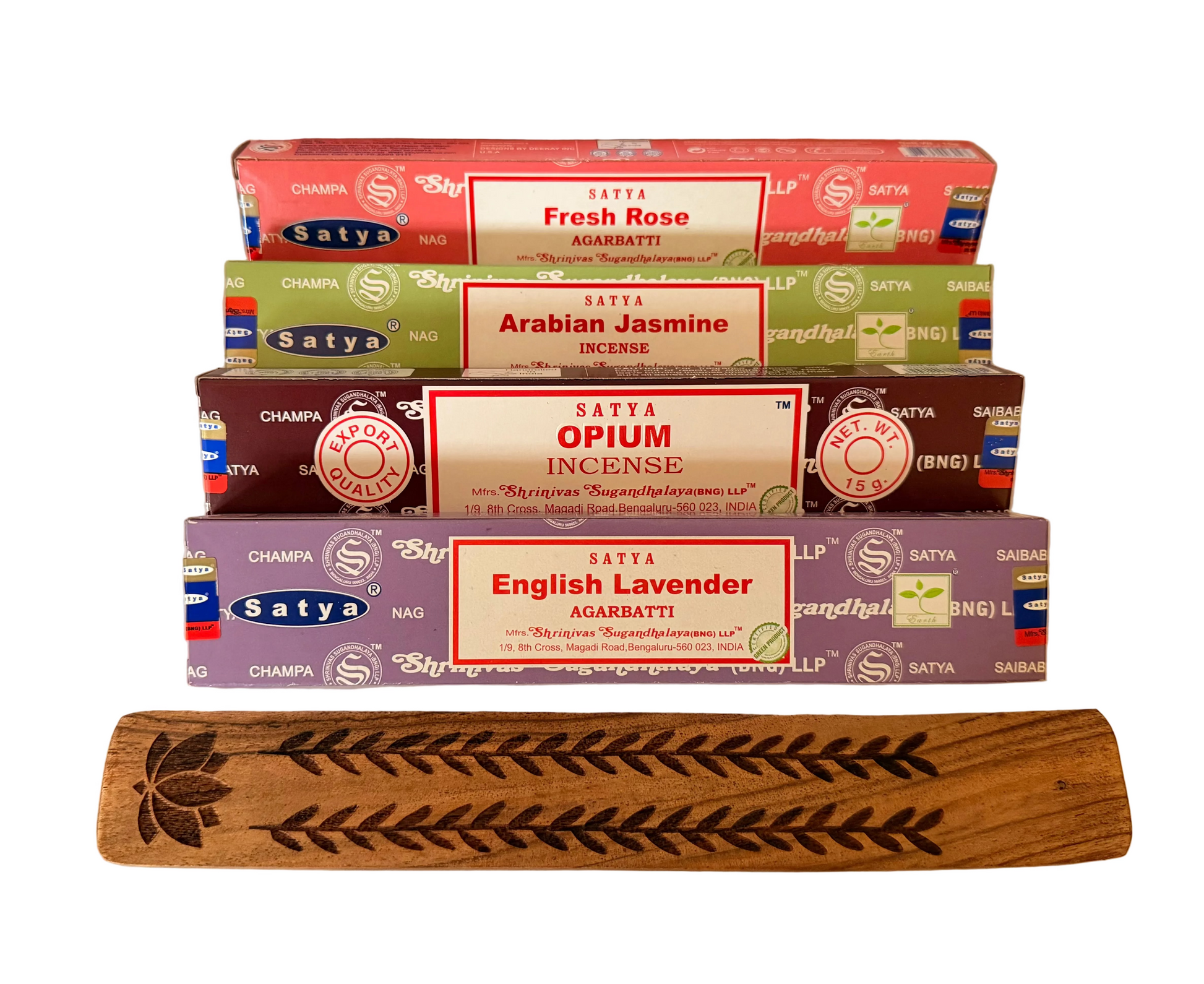 Stack of Satya incense boxes with a wooden incense stick holder on a white background