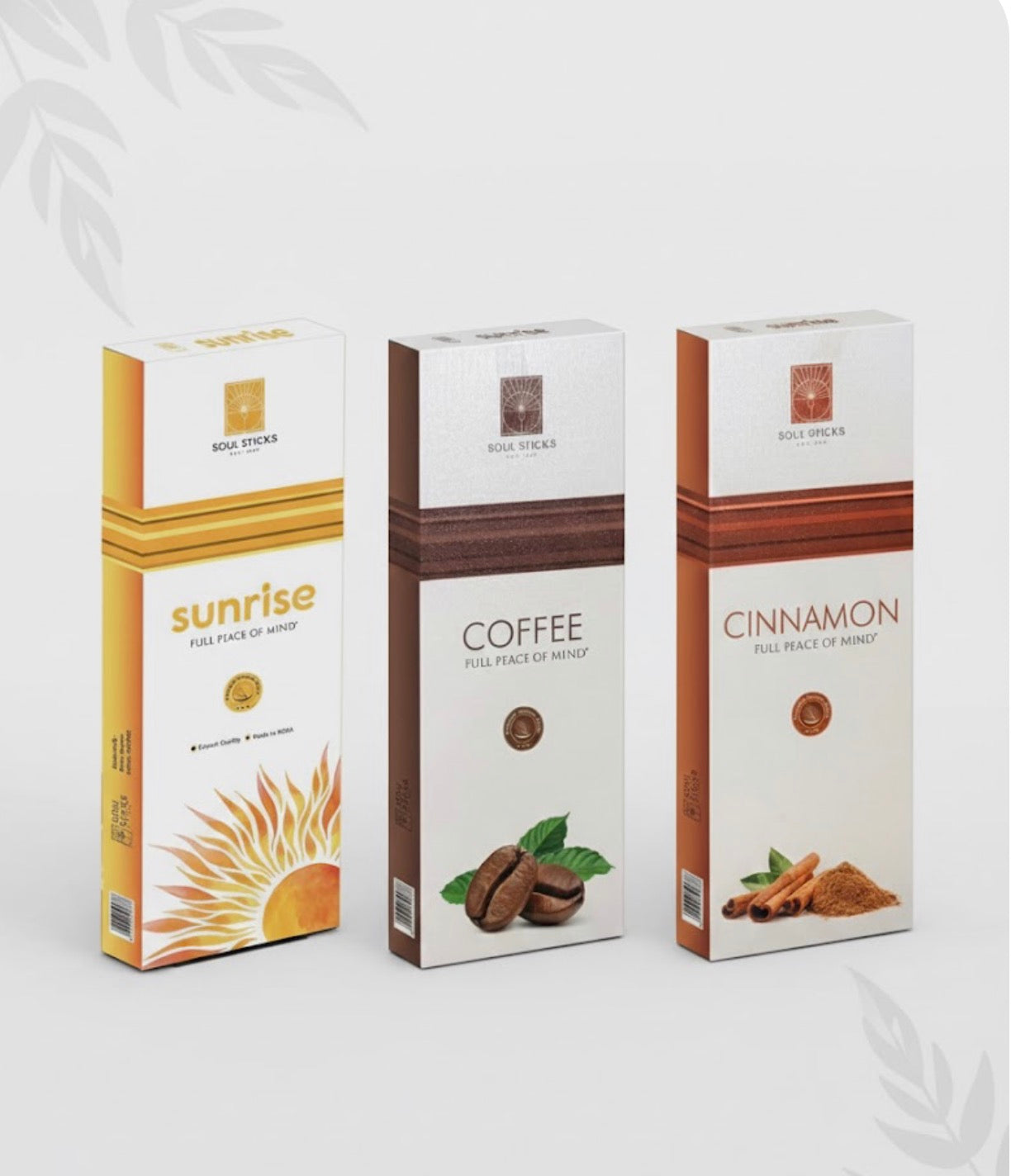 Three boxes of different incense scents on a white background