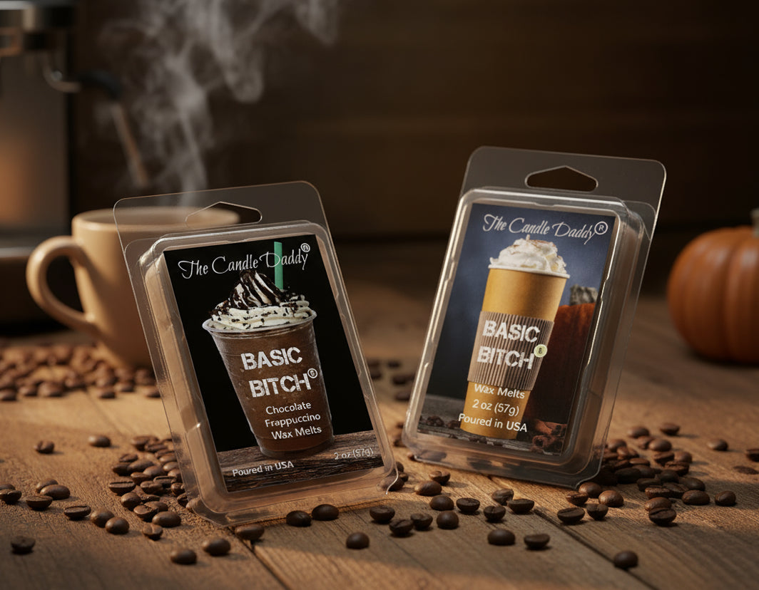 Two wax melts packaging labeled 'Basic Bitch' on a wooden surface with coffee beans and a coffee cup in the background.