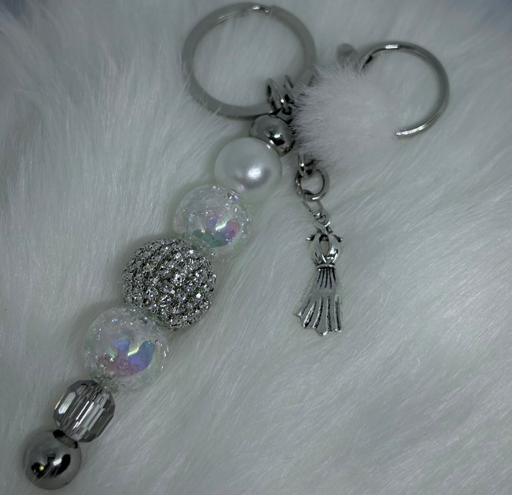 Keychain with decorative beads and charms on a textured white background. Marilyn Monroe Inspired. Monroe. 