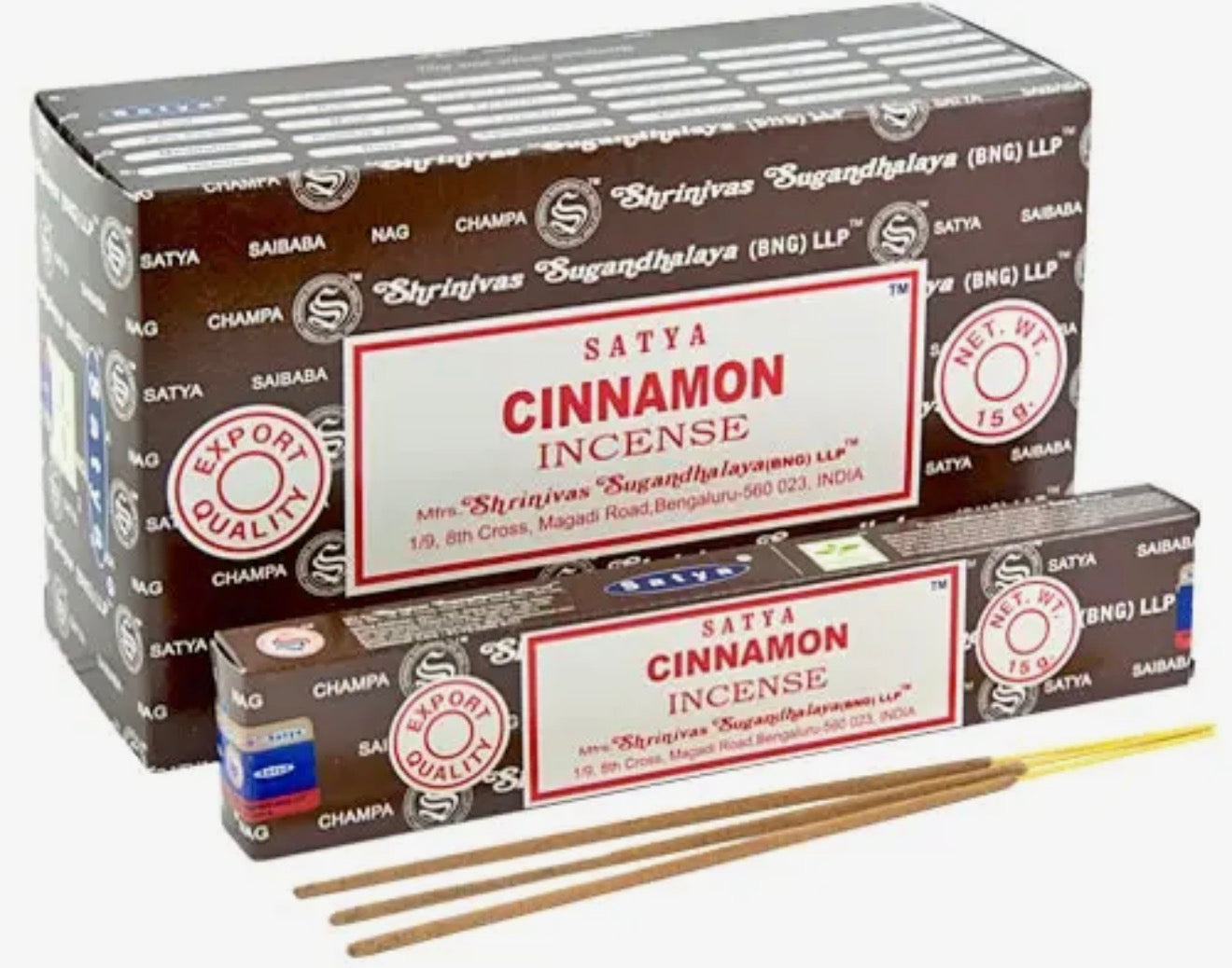 Satya Cinnamon incense packaging with incense sticks on a white background