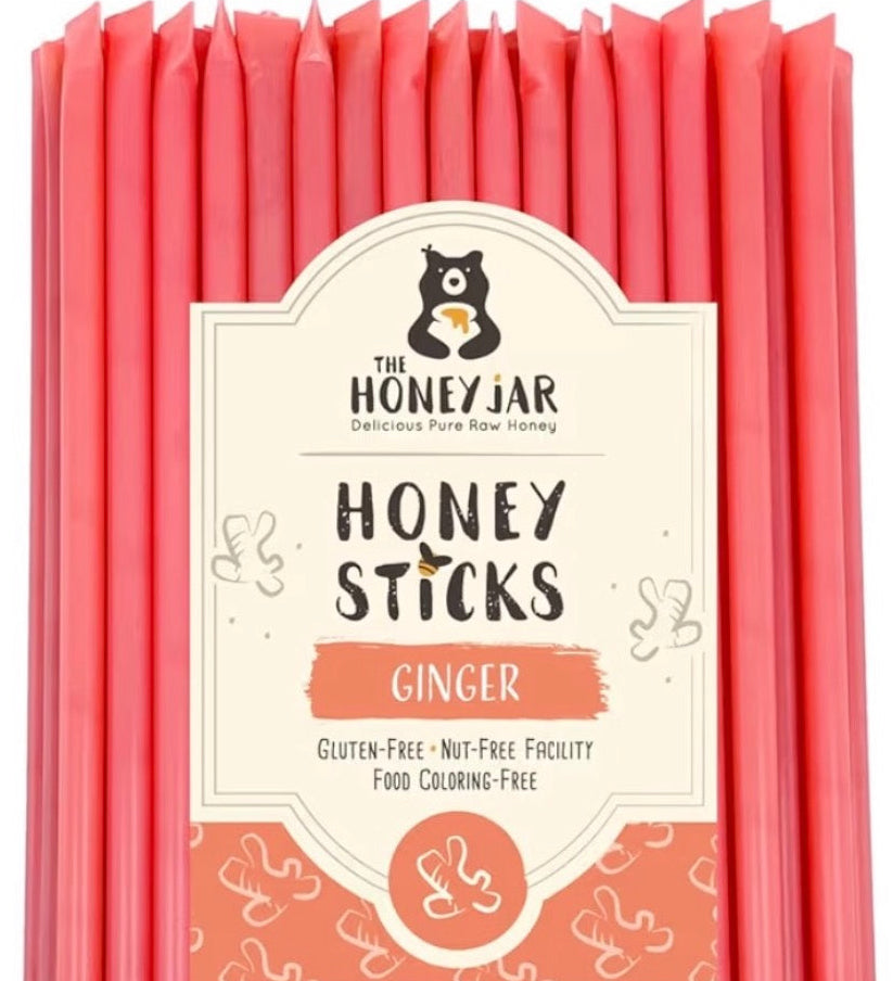 Pack of Honey Sticks with ginger flavor packaging on a white background
